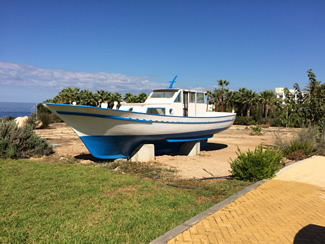 Small boat on the edge of the carpark